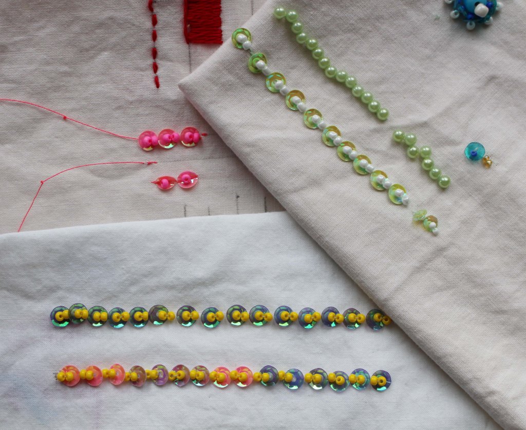 sequin-rows-beads-yellow-white-embroidery-technique-on-white-cloth